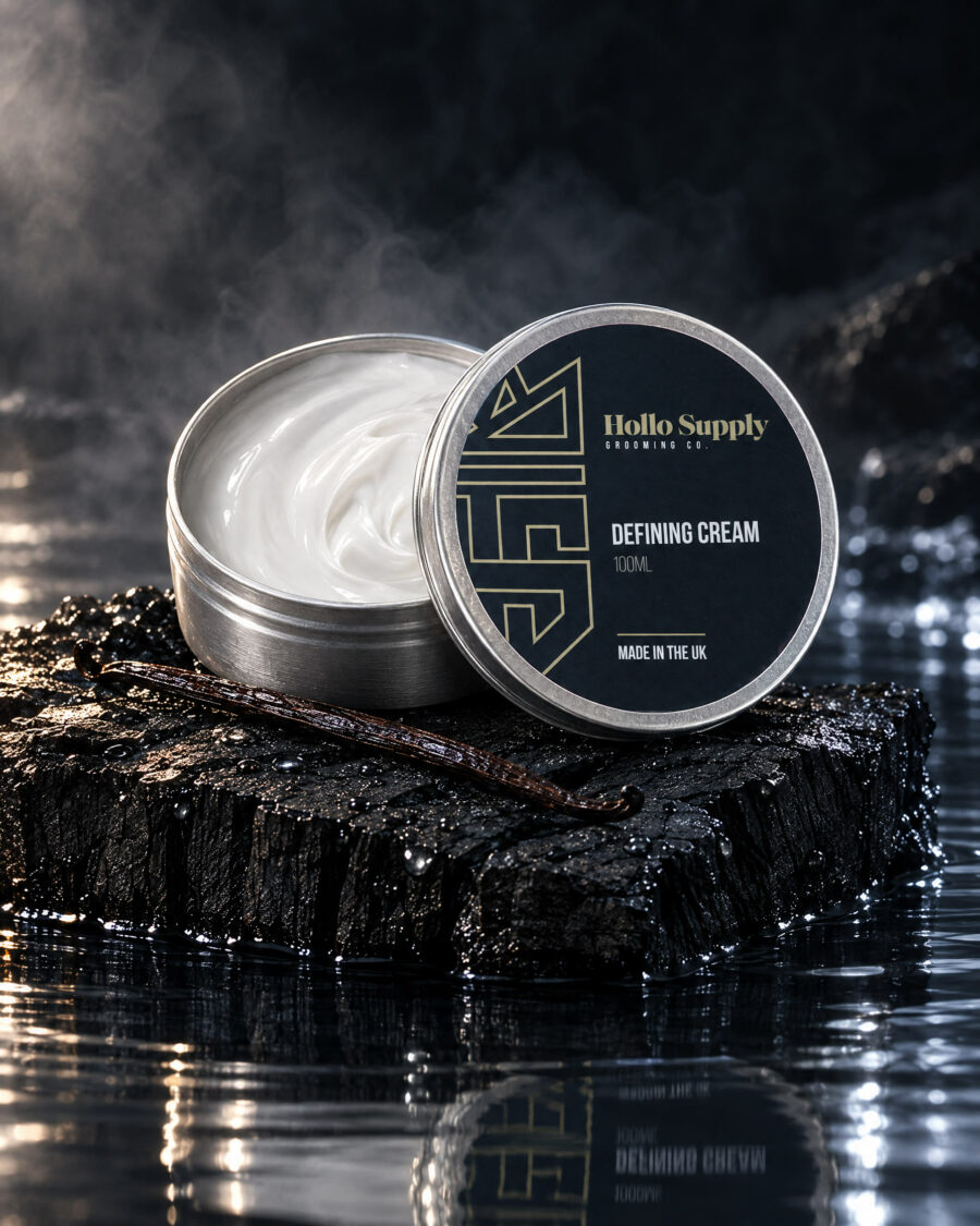 Defining Cream (100ml) by Hollo Supply Grooming Co., photographed on wet charcoal stone with water