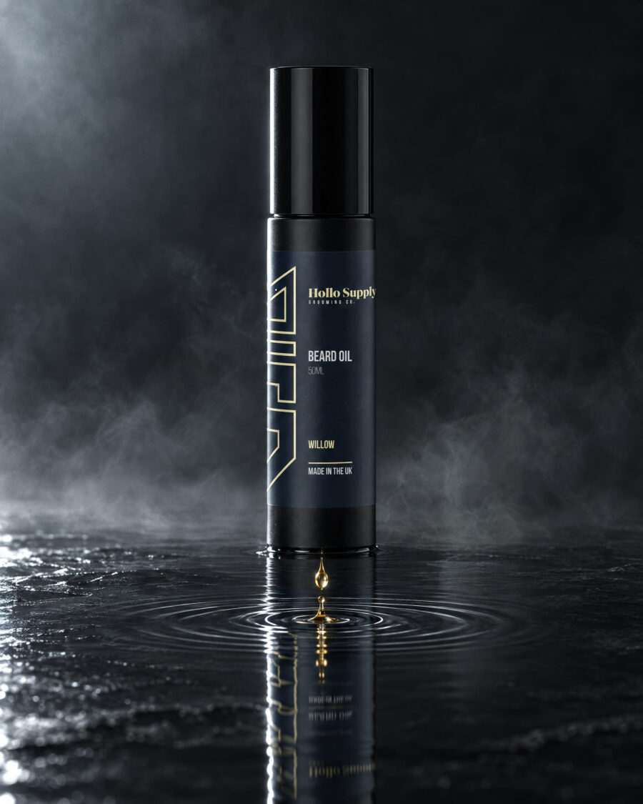 Beard Oil (Willow) by Hollo Supply Grooming Co., photographed on wet charcoal stone with water