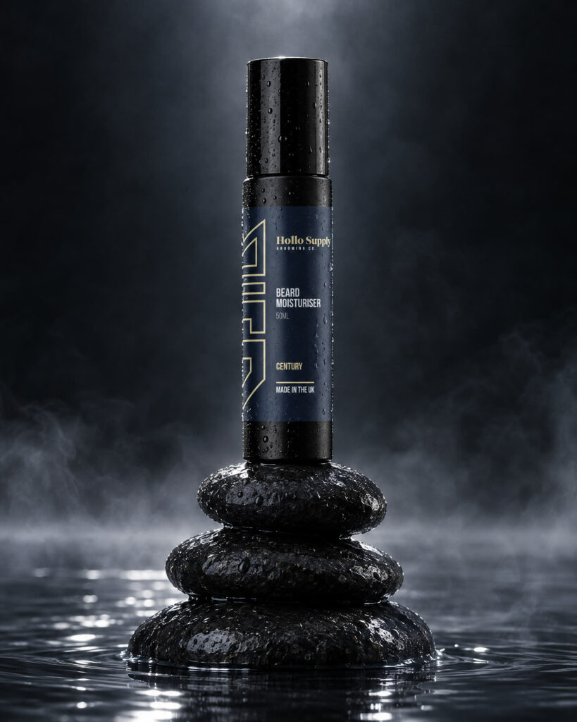 Beard Moisturiser (Century) by Hollo Supply Grooming Co., photographed on wet charcoal stone with water