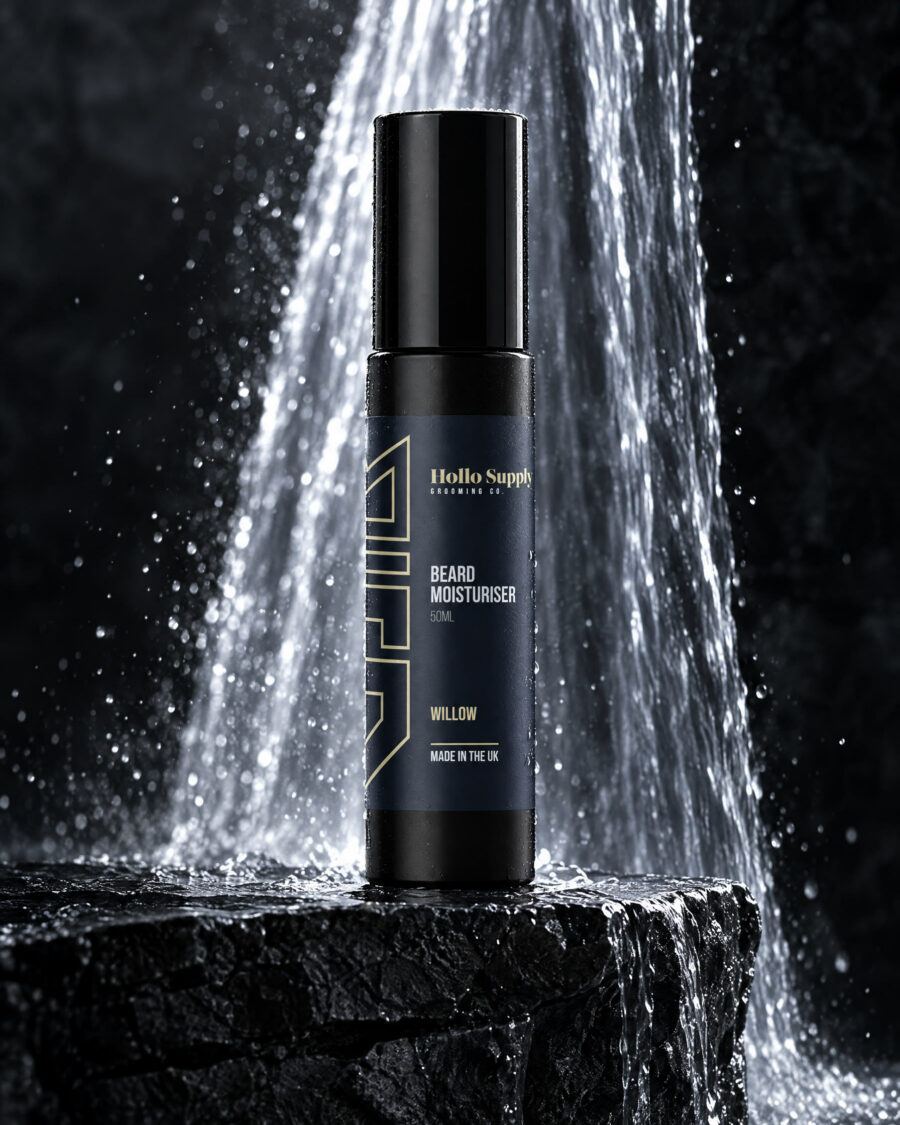 Beard Moisturiser (Willow) by Hollo Supply Grooming Co., photographed on wet charcoal stone with water