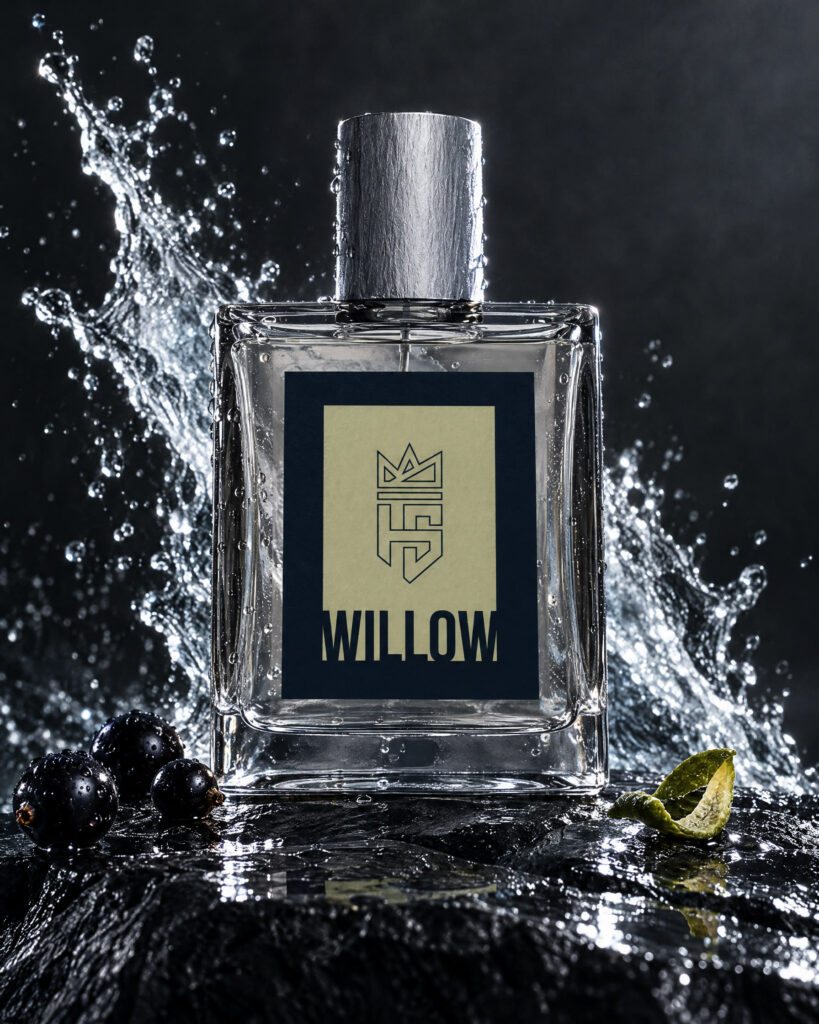 Willow Cologne by Hollo Supply Grooming Co., photographed on wet charcoal stone with water