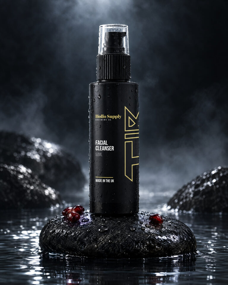 Facial Cleanser by Hollo Supply Grooming Co., photographed on wet charcoal stone with water