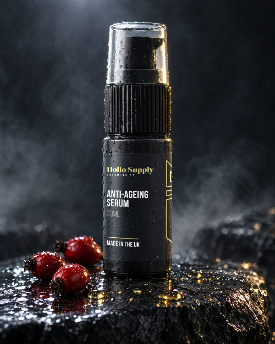 Anti-Ageing Serum by Hollo Supply Grooming Co., photographed on wet charcoal stone with water