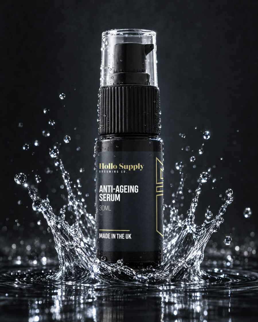 Anti-Ageing Serum by Hollo Supply Grooming Co., photographed on wet charcoal stone with water