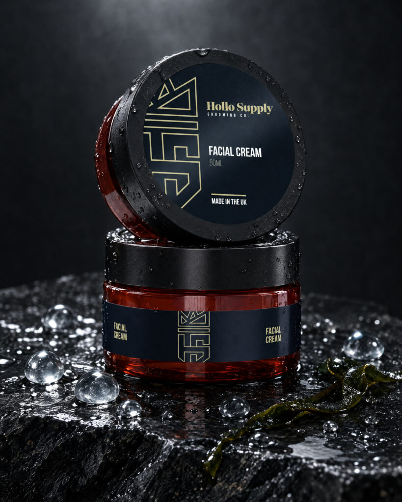 Hydrating Facial Cream by Hollo Supply Grooming Co., photographed on wet charcoal stone with water