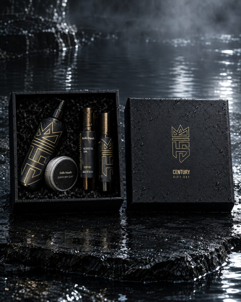 The Century Gift Set by Hollo Supply Grooming Co., photographed on wet charcoal stone with water