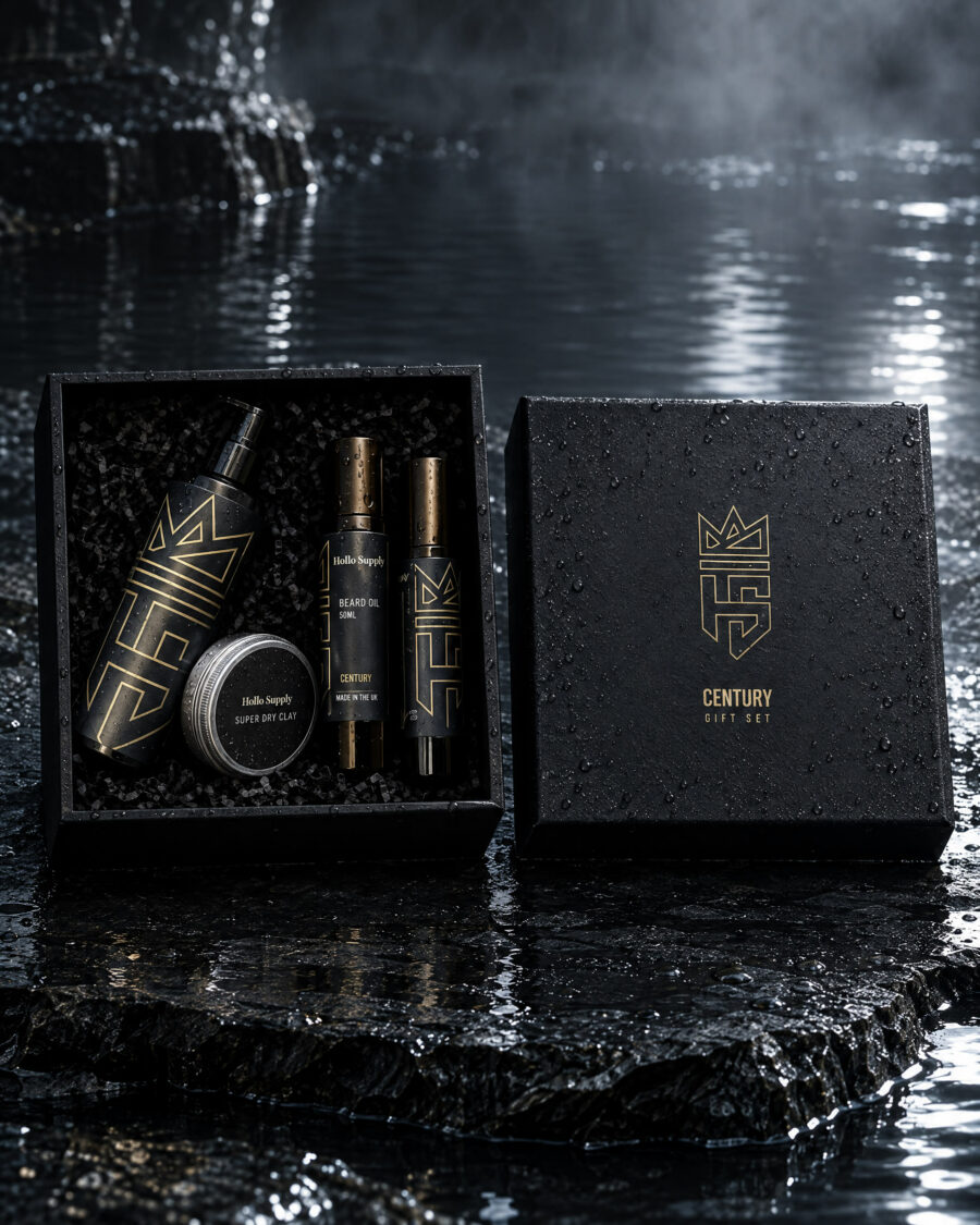 The Century Gift Set by Hollo Supply Grooming Co., photographed on wet charcoal stone with water